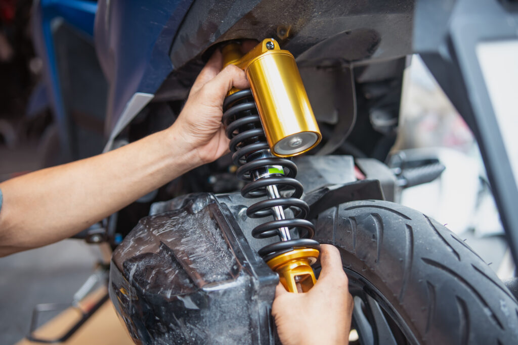 motorcycle mechanic check and Change rear Shock Absorbers motorc